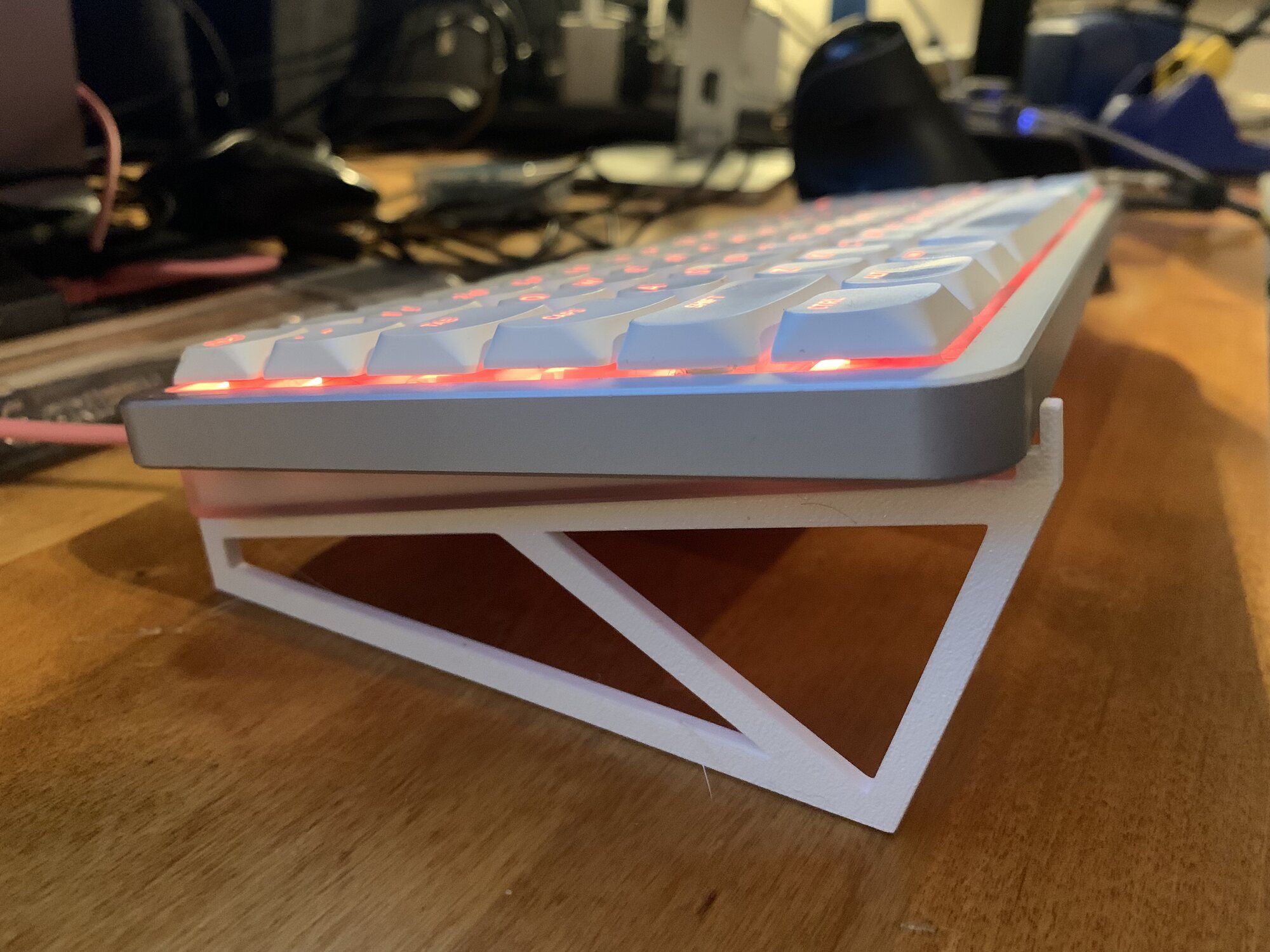 The first 3D-printed lifter fitted beneath the keyboard